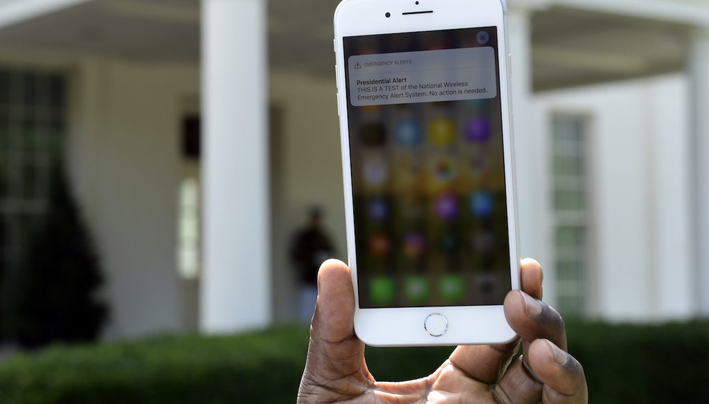 The first test of the national Wireless Emergency Alert system in 2018 is shown on a cellular phone at the White House. A new national test is scheduled for Oct. 4, 2023. (AP)