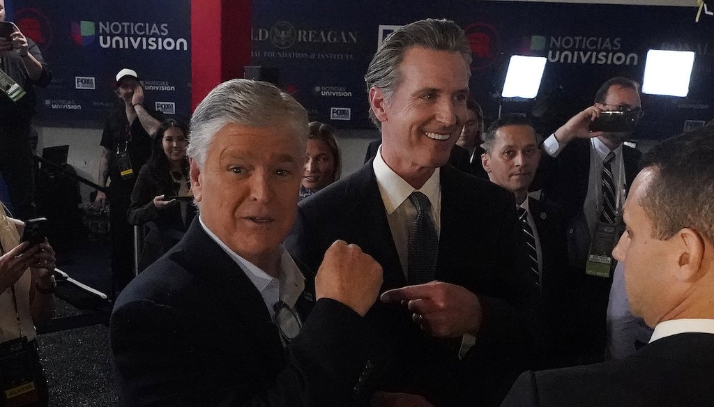 California Gov. Gavin Newsom jokes with Fox News commentator Sean Hannity in the spin room at a Republican presidential primary debate on Sept. 27, 2023, in Simi Valley, Calif. (AP)