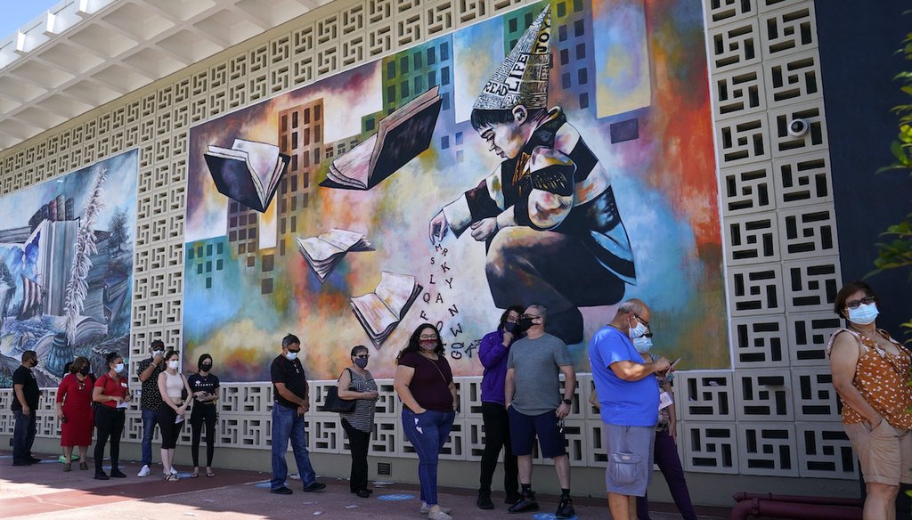 People stand in line for early voting at the John F. Kennedy Library, Tuesday, Oct. 27, 2020, in Hialeah, Fla. (AP)