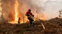 Fire fighters tackle a wildfire in the Aveiro region of Portugal, on Wednesday, Sept. 18, 2024. Firefighters are battling blazes in the region of Aveiro and other areas of northern Portugal for a fourth day after temperatures increased earlier this week. Photographer: Jose Sarmento Matos/Bloomberg via Getty Images