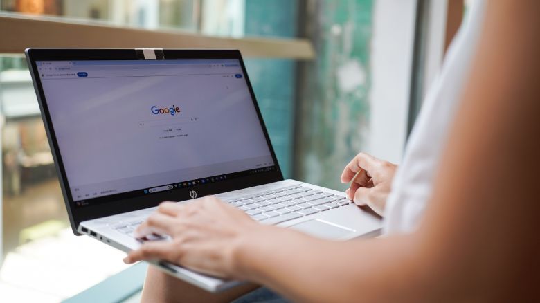 In this photo illustration, A woman browses the Google website on her laptop, which has the search engine technology Brands and logos in Hong Kong, China - 29 September 2024